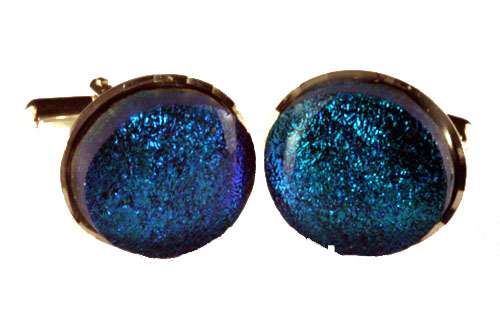 Irridescent blue cufflinks set in a diamond-cut mount