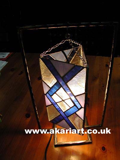 Hanging shade with electric light